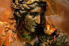 Bronze medallion with Athena, depicted as a Promachos, bearing her aegis and a helmet with Medusa.[-200].Archaeological Museum of Thessaloniki,Greece.