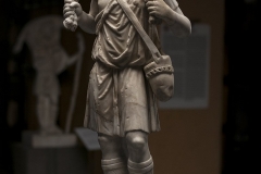 Statuette of the “Good Shepherd”. Fragmentary relief from the front of a sarcophagus, reworked in full relief. End of the 3rd - beginning of the 4th century AD.