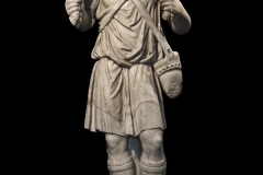 Statuette of the “Good Shepherd”. Fragmentary relief from the front of a sarcophagus, reworked in full relief. End of the 3rd - beginning of the 4th century AD.
