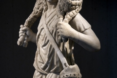 Statuette of the “Good Shepherd”. Fragmentary relief from the front of a sarcophagus, reworked in full relief. End of the 3rd - beginning of the 4th century AD.